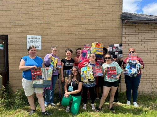 Participants with the boro bags they made in collaboration with The Red Hen Project