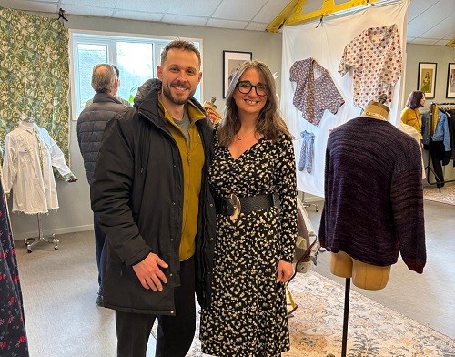 Theodore Panagiotidis, Sew Positive Trustee, with the charity's CEO Melissa Santiago Val at the exhibition